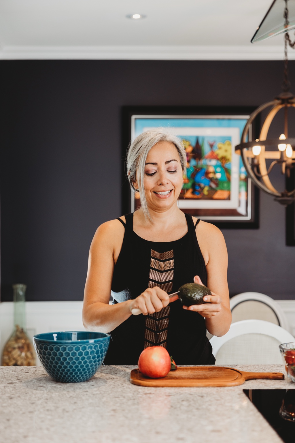 Sandy preparing food in her kitchen